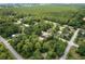 Aerial view of new home under construction in a mature wooded setting at 11506 Nw 20Th St, Ocala, FL 34482