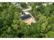 Wooded homesite featuring new construction with dark roof and private setting, aerial view at 11506 Nw 20Th St, Ocala, FL 34482