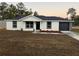 Charming single-story home featuring a freshly landscaped front yard and a two-car garage at 11506 Nw 20Th St, Ocala, FL 34482