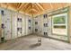 Interior of a home under construction, showcasing the framing and window at 11506 Nw 20Th St, Ocala, FL 34482