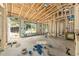 View of the interior of a home under construction showing bare studs and a door to a yard at 11506 Nw 20Th St, Ocala, FL 34482