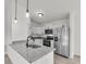 Modern kitchen showcasing white cabinets, granite countertops, and stainless steel appliances at 11506 Nw 20Th St, Ocala, FL 34482