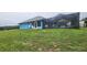 Backyard with a screened in pool and an expansive lawn at 12524 Sw 109Th Pl, Dunnellon, FL 34432