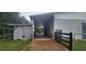View of the barn and shelter featuring covered areas and wooden fencing at 12524 Sw 109Th Pl, Dunnellon, FL 34432