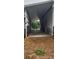 Barn featuring covered area with concrete flooring and access to exterior paddocks at 12524 Sw 109Th Pl, Dunnellon, FL 34432