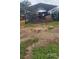 Outdoor barn with hay and equipment provides ample storage and shelter for farm animals and machinery at 12524 Sw 109Th Pl, Dunnellon, FL 34432