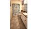 A bathroom with tile floors, a white vanity, and a shower featuring a blue patterned shower curtain at 12524 Sw 109Th Pl, Dunnellon, FL 34432