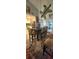 Spacious dining room with a rustic table and view of the kitchen at 12524 Sw 109Th Pl, Dunnellon, FL 34432
