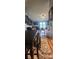 Dining room with views into the living room, and hardwood floors at 12524 Sw 109Th Pl, Dunnellon, FL 34432