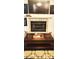 A beautiful fireplace in the home's living room provides a cozy and inviting focal point at 12524 Sw 109Th Pl, Dunnellon, FL 34432