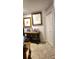 Entryway with beige tiled flooring and grey walls, with a table, pictures and closet at 12524 Sw 109Th Pl, Dunnellon, FL 34432
