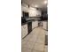 The kitchen features modern appliances, ample counter space, and custom white cabinetry at 12524 Sw 109Th Pl, Dunnellon, FL 34432