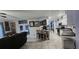 Open kitchen featuring an eat-in bar and modern appliances at 12524 Sw 109Th Pl, Dunnellon, FL 34432