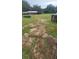 View of land with barns and paddocks in the background at 12524 Sw 109Th Pl, Dunnellon, FL 34432