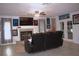Spacious living room with a fireplace, tile flooring, and a ceiling fan at 12524 Sw 109Th Pl, Dunnellon, FL 34432