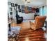 Living room showcasing many pictures, shiny hardwood floors and a ceiling fan at 12524 Sw 109Th Pl, Dunnellon, FL 34432
