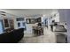 An open-concept living space that merges the living room, dining area and modern kitchen at 12524 Sw 109Th Pl, Dunnellon, FL 34432