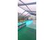Enclosed swimming pool and spa with clear enclosure and outdoor furniture at 12524 Sw 109Th Pl, Dunnellon, FL 34432
