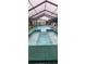 Enclosed swimming pool and attached spa with covered enclosure at 12524 Sw 109Th Pl, Dunnellon, FL 34432