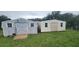 Exterior view of two sheds on a lot with a lawn at 12524 Sw 109Th Pl, Dunnellon, FL 34432