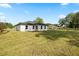 Expansive backyard featuring lush green grass and a peaceful atmosphere at 13803 Se 44Th Ave, Summerfield, FL 34491