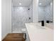 Modern bathroom with quartz countertop, black hardware, and walk-in shower at 13803 Se 44Th Ave, Summerfield, FL 34491