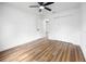 Bright bedroom featuring a ceiling fan and double closet with laminate flooring at 13803 Se 44Th Ave, Summerfield, FL 34491