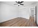 Bedroom with a ceiling fan, laminate flooring, and a double door closet at 13803 Se 44Th Ave, Summerfield, FL 34491