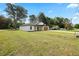Inviting home featuring a well-manicured lawn and attractive craftsman-style details at 13803 Se 44Th Ave, Summerfield, FL 34491