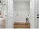 A small laundry room area is accessible through double doors at 13803 Se 44Th Ave, Summerfield, FL 34491