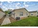 This cozy home has a well manicured lawn and shaded, screened-in porch at 1405 Espinoza Ln, Lady Lake, FL 32159