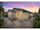 Charming single-story home featuring a cozy screened-in lanai and a well-maintained landscaped yard at 1405 Espinoza Ln, Lady Lake, FL 32159