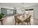 Open-concept living space featuring a dining area and a cozy living room with plenty of natural light at 1405 Espinoza Ln, Lady Lake, FL 32159
