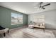 Bright living room featuring a cozy seating area, ample natural light, and wood-look flooring at 1405 Espinoza Ln, Lady Lake, FL 32159