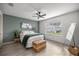 Inviting bedroom boasts natural light, neutral tones, and a ceiling fan at 1405 Espinoza Ln, Lady Lake, FL 32159