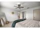 Relaxing bedroom featuring an ensuite bathroom and a decorative ceiling fan at 1405 Espinoza Ln, Lady Lake, FL 32159