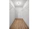 Spacious walk-in closet features wood-look flooring and wire shelving for storage at 1405 Espinoza Ln, Lady Lake, FL 32159