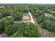 This aerial view shows a community with treed streets and homes under construction at 14650 Sw 33Rd Ln, Ocala, FL 34481