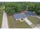 Aerial view of a single-Gathering home with a large driveway and well-maintained landscaping in a quiet neighborhood at 14650 Sw 33Rd Ln, Ocala, FL 34481