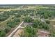 Great aerial perspective of a home and surrounding neighborhood, illustrating the serene, natural environment at 14650 Sw 33Rd Ln, Ocala, FL 34481