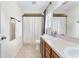 Bathroom featuring a single sink vanity and shower with a neutral color palette at 14650 Sw 33Rd Ln, Ocala, FL 34481
