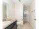 Bathroom featuring a single sink vanity and shower with a neutral color palette at 14650 Sw 33Rd Ln, Ocala, FL 34481