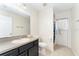 Bathroom features a single sink vanity and shower with a neutral color palette and decor at 14650 Sw 33Rd Ln, Ocala, FL 34481