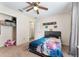 Bedroom features a closet, carpet flooring, ceiling fan, and a modern theme at 14650 Sw 33Rd Ln, Ocala, FL 34481