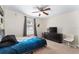 Bedroom features a dresser, carpet flooring, ceiling fan, and a modern theme at 14650 Sw 33Rd Ln, Ocala, FL 34481