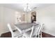 Dining area featuring dark wood floors, stylish decor, and a view into a nearby room at 14650 Sw 33Rd Ln, Ocala, FL 34481