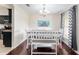Dining area featuring dark wood floors, stylish decor, and a view into the adjacent kitchen at 14650 Sw 33Rd Ln, Ocala, FL 34481
