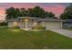 Charming single-story home with a well-manicured lawn, mature trees and neutral color palette at 14650 Sw 33Rd Ln, Ocala, FL 34481