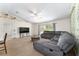 Bright living room with large sectional sofa and sliding glass doors at 14650 Sw 33Rd Ln, Ocala, FL 34481