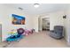 Open-concept living room boasts carpeted floors and an open archway to the dining room at 14650 Sw 33Rd Ln, Ocala, FL 34481